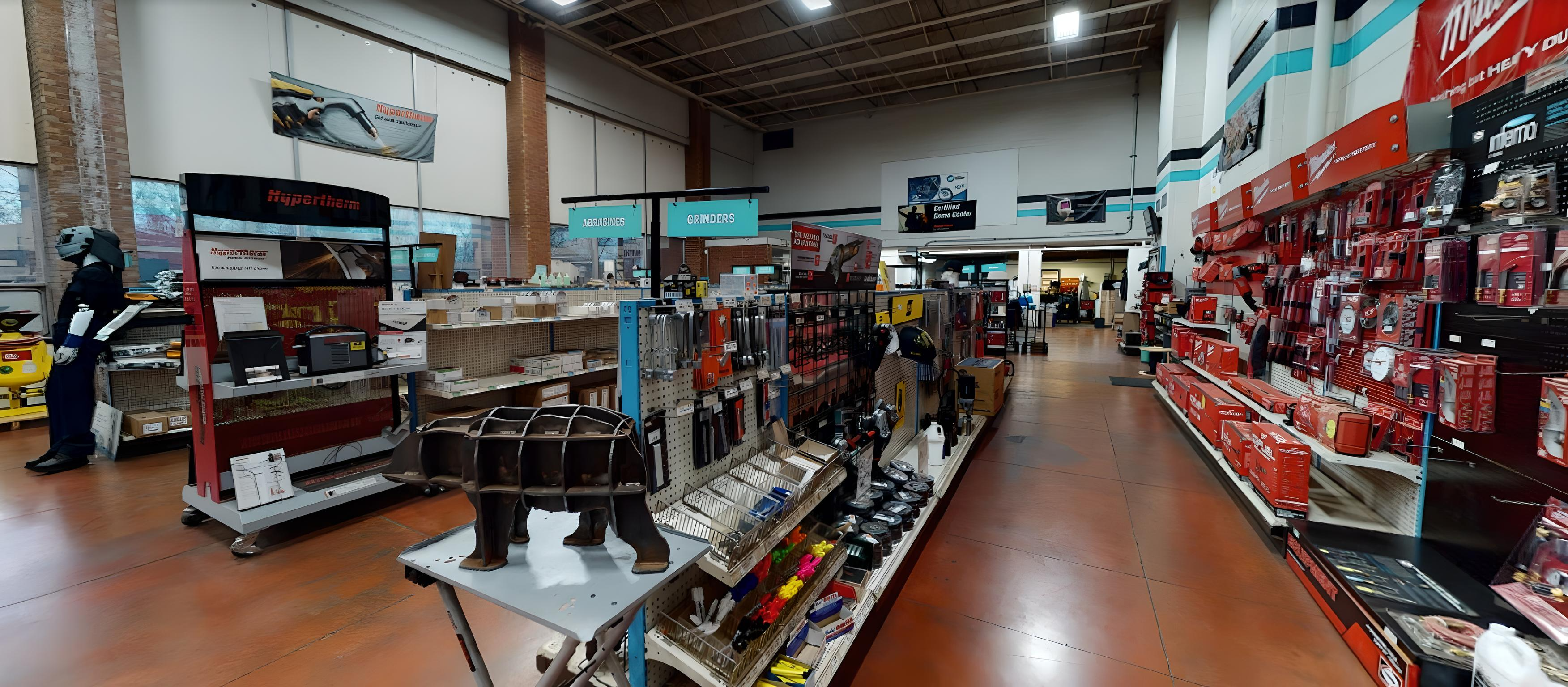 Haun Welding Supply Syracuse showroom with clearly marked aisles and overhead signage.