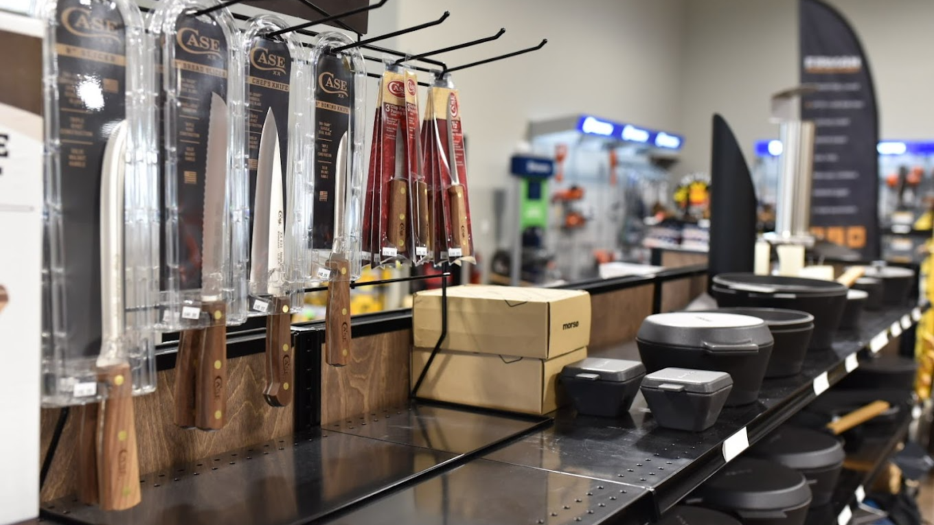 Close-up of Weathered Teak wood slatwall gondola shelving displaying outdoor power accessories and hardware